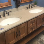 SFI two-toned, cultured marble bathroom vanity sink top with a white sink, speckled tan vanity top, and a matte finish.