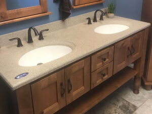SFI two-toned, cultured marble bathroom vanity sink top with a white sink, speckled tan vanity top, and a matte finish.